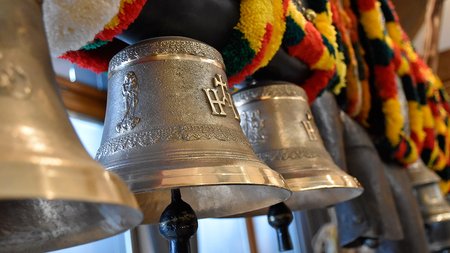 The eco-friendly way to enjoy South Tyrol Close-up of traditional silver cowbells with colorful decorative straps