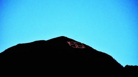The eco-friendly way to enjoy South Tyrol Illuminated number 1981 on a mountain at dusk