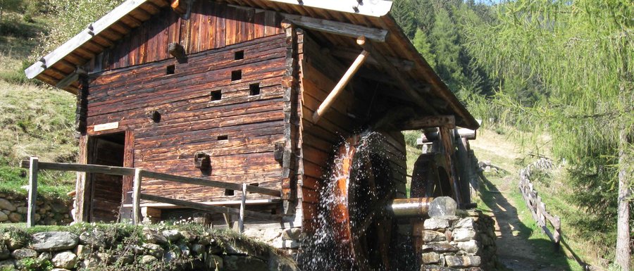 The Gitschberg webcams Wooden watermill with water wheel in forested mountain area