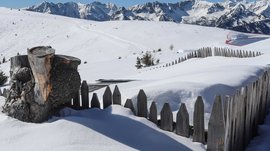 Vals - Jochtal - Steinermandl Snow-covered fence with mountain view in winter