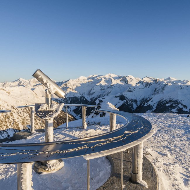 Skiing in South Tyrol: the Gitschberg Jochtal ski resort Telescope on snowy mountain peak overlooking snow-covered Alps
