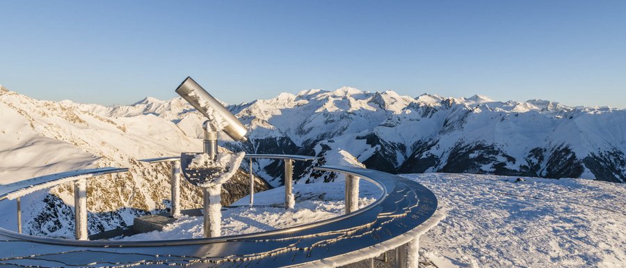 The Gitschberg webcams Telescope on snowy mountain peak overlooking snow-covered Alps