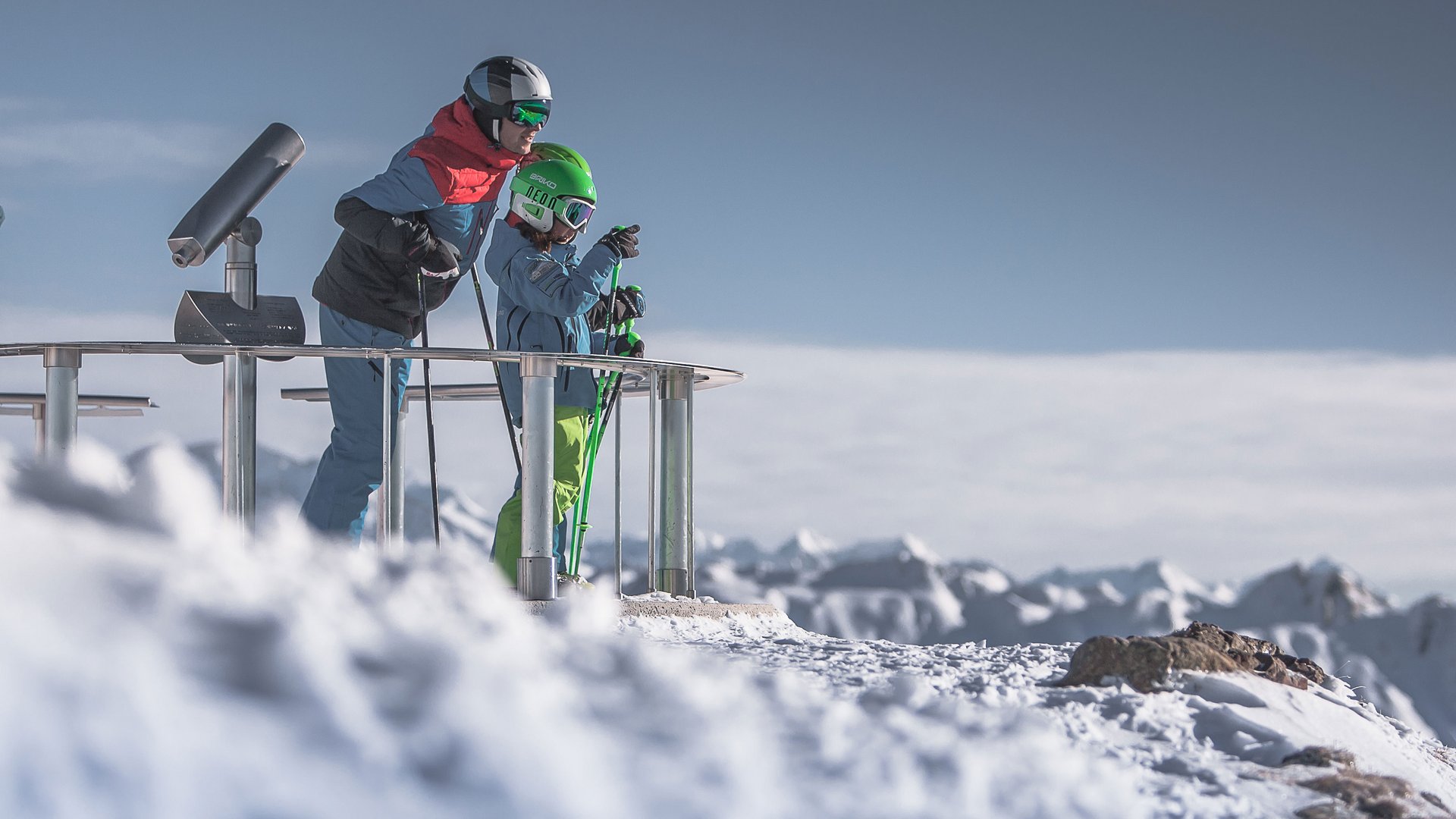 The Gitschberg panoramic platform in Meransen, Italy Two skiers standing on a snowy mountain viewing platform