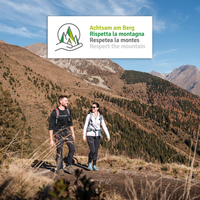 The eco-friendly way to enjoy South Tyrol Hikers walking on mountain path with Respect the mountain sign